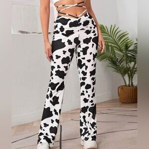 Shein, white and black cow print pants, size small.